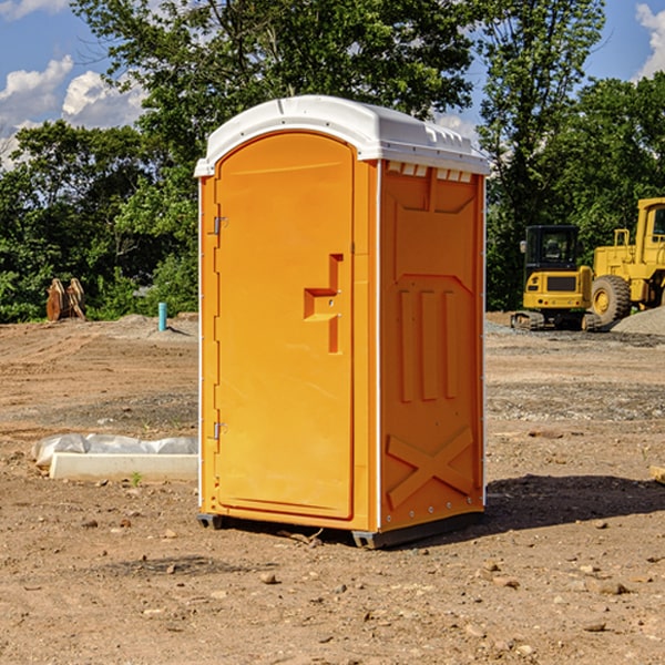 what is the cost difference between standard and deluxe porta potty rentals in Bruno